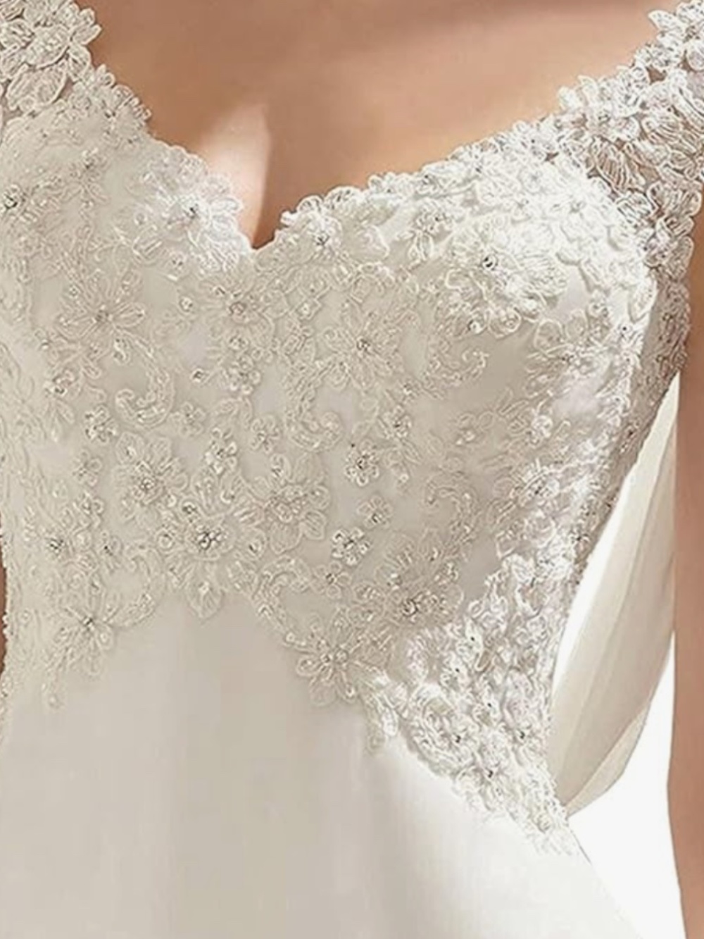 A timeless ivory dress with delicate lace appliqué and subtle beadwork on the bo - Picture 4 of 4